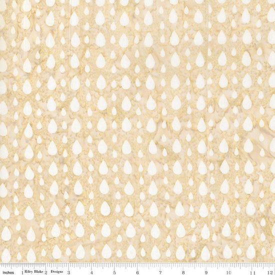 Image of Batiks Around the World London Toasted Almonds quilting cotton fabric by Tara Reed for Riley Blake Designs. Features raindrops on a cream background. Cute Little Fabric Shop.
