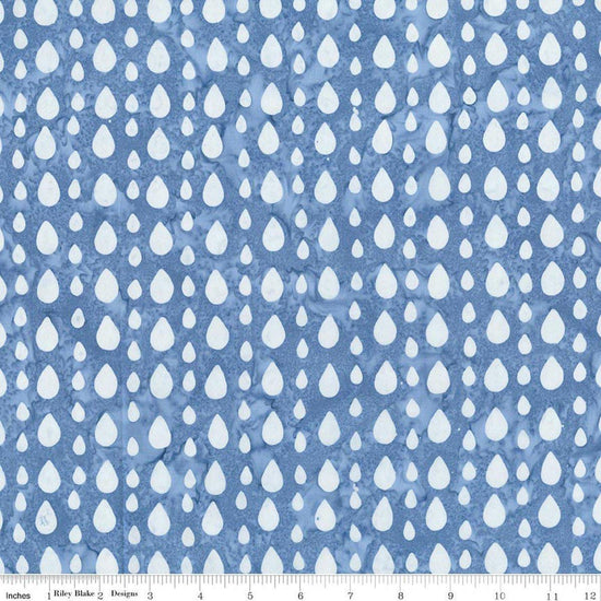 Image of Batiks Around the World London Skystone quilting cotton fabric by Tara Reed for Riley Blake Designs. Features raindrops on a blue background. Cute Little Fabric Shop.