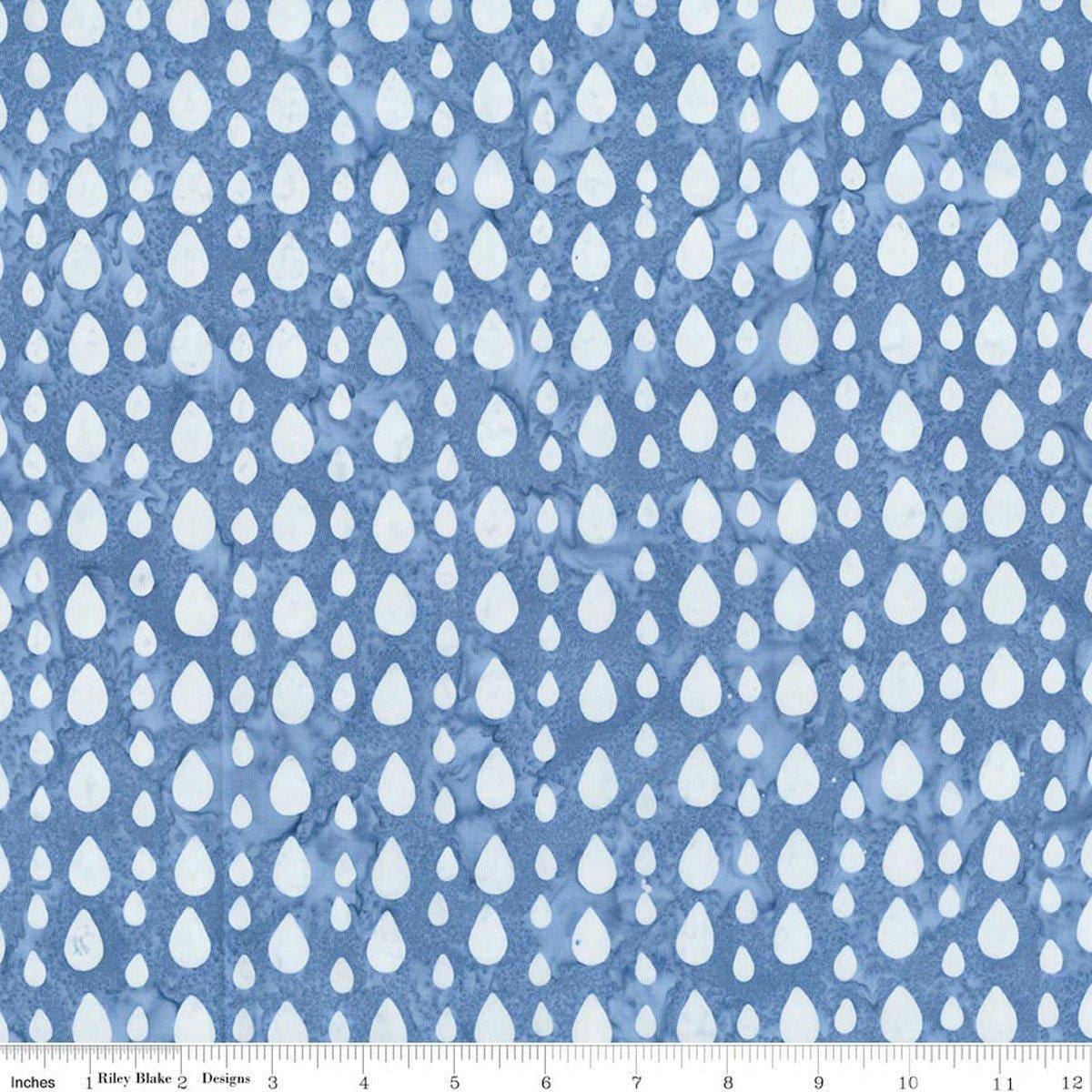 Image of Batiks Around the World London Skystone quilting cotton fabric by Tara Reed for Riley Blake Designs. Features raindrops on a blue background. Cute Little Fabric Shop.