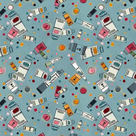 Image of Drawn to Create Paint Tubes Dusty Teal quilting cotton fabric by Eulalia Mejia for QT Fabrics. Features art supplies on a blue background. Cute Little Fabric Shop.