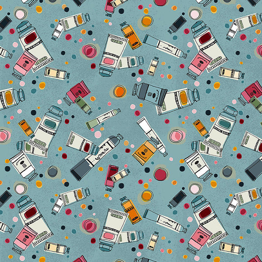 Image of Drawn to Create Paint Tubes Dusty Teal quilting cotton fabric by Eulalia Mejia for QT Fabrics. Features art supplies on a blue background. Cute Little Fabric Shop.