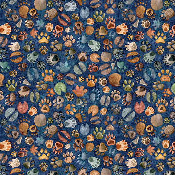 Image of Terrors of the Pleistocene Animal Tracks Navy quilting cotton fabric by Morris Creative Group for QT Fabrics. Features foot prints on a blue background. Cute Little Fabric Shop.